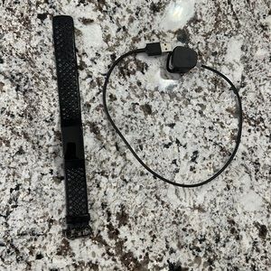 Fitbit charge 4 with charger.  Used but in great shape!
